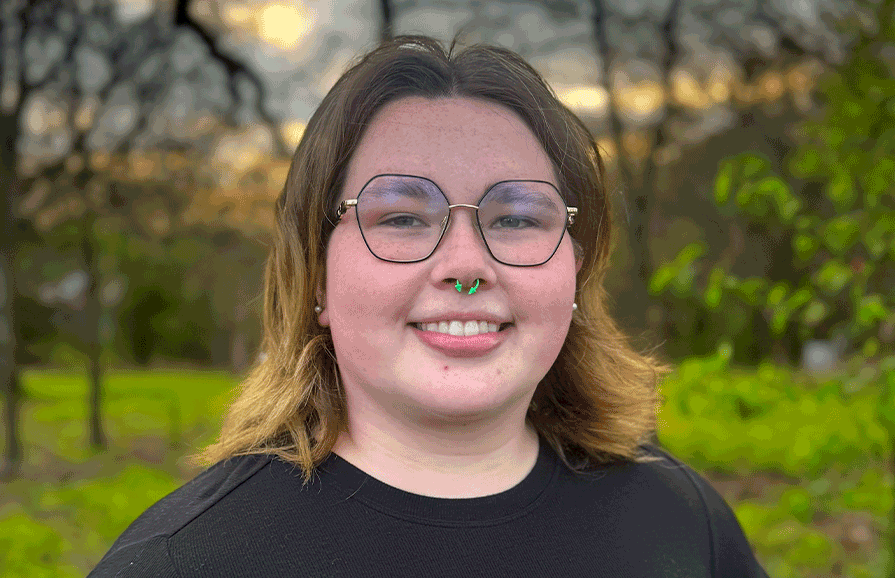 girl smiling in the woods